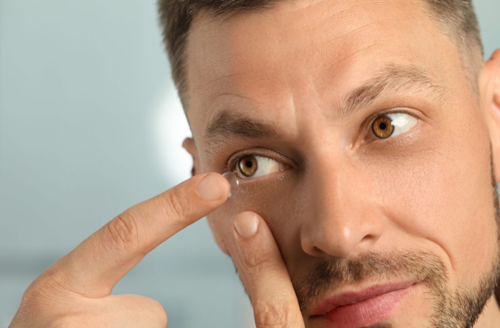 A contact lens wearer putting in their lenses for the day