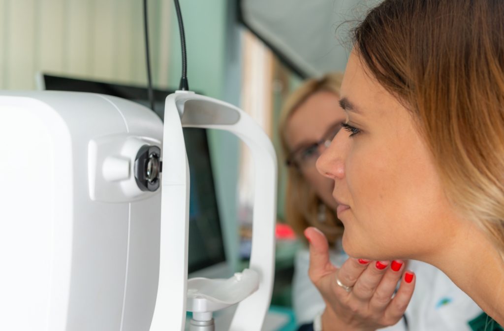 An optometrist conducts precise optical coherence tomography on a patient to catch signs of eyesight worsening early.