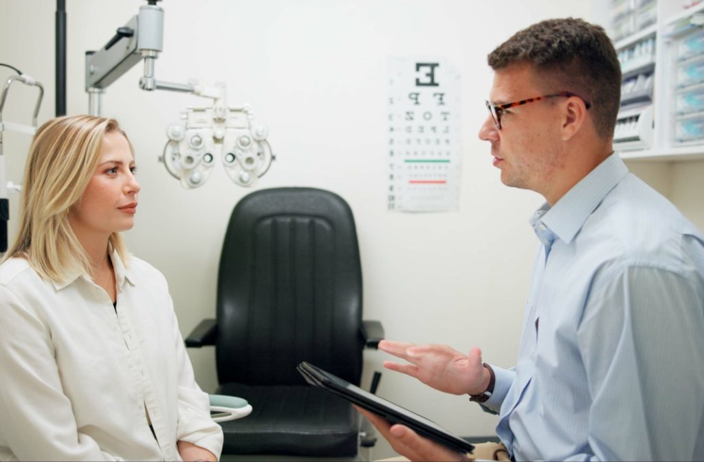 ye doctor consulting with a patient in an office setting.