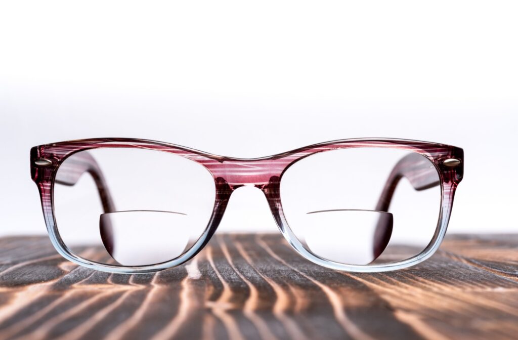 Close-up of bifocal eyeglasses with visible reading segment.