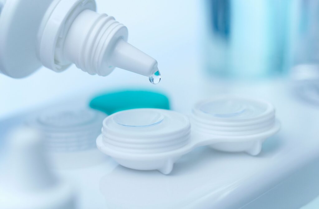 Fresh contact lens solution being added to a case with contact lenses in it to clean them after they fell out.