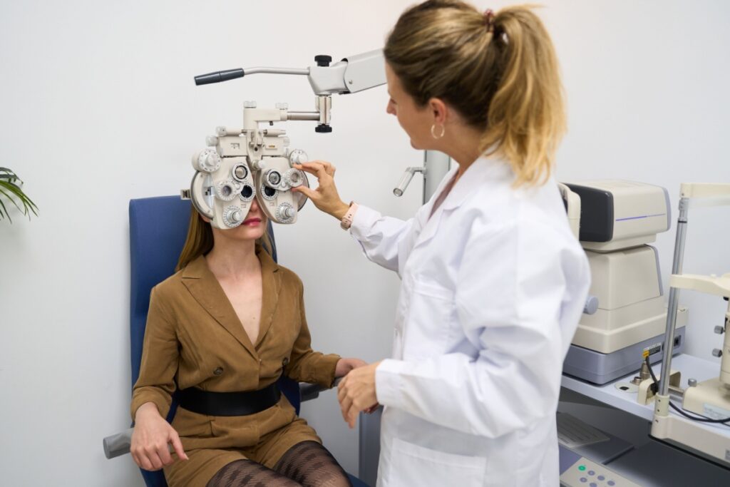 A patient having an eye exam to monitor for vision issues and overall health issues.